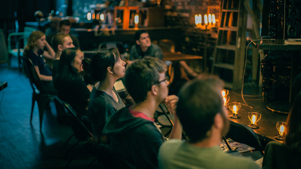 Audience at the foot of the stage